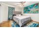 Comfortable bedroom featuring a striking accent painting, ceiling fan, and area rug at 2810 Dunnington Cir, Chamblee, GA 30341