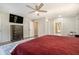 This bedroom boasts a ceiling fan and a large dresser, offering both comfort and storage at 2810 Dunnington Cir, Chamblee, GA 30341