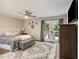 Bright bedroom featuring a ceiling fan, deck access, and stylish decor for a comfortable living space at 2810 Dunnington Cir, Chamblee, GA 30341