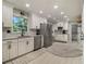 Modern kitchen featuring white cabinets, stainless steel appliances, and natural lighting at 2810 Dunnington Cir, Chamblee, GA 30341