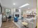 Open-concept living room with fireplace, skylight, and hardwood floors at 2810 Dunnington Cir, Chamblee, GA 30341
