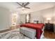 Cozy primary bedroom featuring hardwood floors and a ceiling fan, with ensuite bathroom at 2810 Dunnington Cir, Chamblee, GA 30341