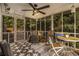 Cozy screened porch with patterned flooring and wicker furniture, perfect for relaxing outdoors at 2810 Dunnington Cir, Chamblee, GA 30341