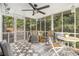 Inviting screened porch with ceiling fan and stylish outdoor seating at 2810 Dunnington Cir, Chamblee, GA 30341