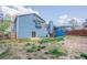 Spacious backyard featuring a well-maintained lawn and a charming view of the home's exterior at 4809 Burlington Nw Ct, Acworth, GA 30102