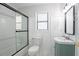 Bright bathroom featuring a glass shower door, modern fixtures, and a stylish vanity at 4809 Burlington Nw Ct, Acworth, GA 30102