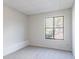 Well-lit bedroom with neutral walls, carpet flooring, and a large window overlooking the backyard at 4809 Burlington Nw Ct, Acworth, GA 30102