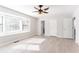 Inviting bedroom featuring a bay window, ceiling fan, and modern light colored flooring at 4809 Burlington Nw Ct, Acworth, GA 30102