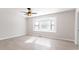 Inviting bedroom featuring a bay window, ceiling fan, and modern light colored flooring at 4809 Burlington Nw Ct, Acworth, GA 30102