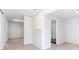 Open living space next to a full bathroom and featuring plank flooring and neutral paint at 4809 Burlington Nw Ct, Acworth, GA 30102