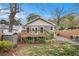 Backyard view of home with deck, gravel pathway, storage shed, and green lawn at 559 Robinson Se Ave, Atlanta, GA 30315