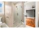Bathroom featuring tiled shower with glass door, tile floors, and access to bedroom at 559 Robinson Se Ave, Atlanta, GA 30315