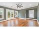 Bedroom featuring hardwood floors, ceiling fan, and doors leading to a deck at 559 Robinson Se Ave, Atlanta, GA 30315