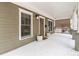 Inviting front porch with decorative columns and a cozy seating area, perfect for relaxing outdoors at 559 Robinson Se Ave, Atlanta, GA 30315