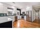 Modern kitchen with stainless steel appliances, white cabinets, and hardwood floors at 559 Robinson Se Ave, Atlanta, GA 30315