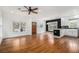 An open-concept living space featuring hardwood floors, modern lighting, and large windows for plenty of natural light at 559 Robinson Se Ave, Atlanta, GA 30315