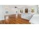 An open-concept living space features hardwood floors, modern lighting, and large windows for plenty of natural light at 559 Robinson Se Ave, Atlanta, GA 30315
