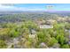 Discover a beautiful Atlanta home nestled amongst lush green trees in a quiet neighborhood setting, view from above at 111 Leathers Circle Nw, Atlanta, GA 30314