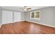 Bedroom with hardwood floors, light walls, window and double closet at 111 Leathers Circle Nw, Atlanta, GA 30314