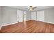 Bright and airy bedroom with light gray walls, hardwood flooring, and double closets at 111 Leathers Circle Nw, Atlanta, GA 30314