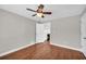 Bedroom with hardwood floors, ceiling fan and access to living room at 111 Leathers Circle Nw, Atlanta, GA 30314