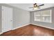 Bedroom with hardwood floors, ceiling fan, and large windows at 111 Leathers Circle Nw, Atlanta, GA 30314