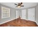 Bedroom with hardwood floors, ceiling fan, and plenty of closet space at 111 Leathers Circle Nw, Atlanta, GA 30314