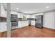 Modern kitchen features white cabinetry, stainless steel appliances, and a mosaic tile backsplash at 111 Leathers Circle Nw, Atlanta, GA 30314