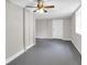 Spacious basement room with gray painted floor and white door and trim at 111 Leathers Circle Nw, Atlanta, GA 30314
