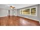 Open-concept living room with gleaming hardwood floors and large windows at 111 Leathers Circle Nw, Atlanta, GA 30314