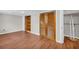 Spacious room with built in shelving, wood floors and white trim at 111 Leathers Circle Nw, Atlanta, GA 30314