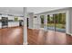 Spacious kitchen and living room featuring granite counters, modern appliances, and wood flooring at 111 Leathers Circle Nw, Atlanta, GA 30314