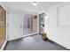 Enclosed back porch with white brick, a storm door and access to the backyard at 111 Leathers Circle Nw, Atlanta, GA 30314