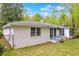 The property features a fenced yard and an enclosed porch area, painted in neutral shades for a seamless look at 111 Leathers Circle Nw, Atlanta, GA 30314
