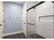 Modern bathroom featuring a glass-enclosed shower with sleek tile and fixtures, plus a storage niche at 208 Greenhill Dr, Dallas, GA 30157