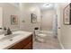 Well-lit bathroom with a vanity, toilet, and a shower/tub combination at 208 Greenhill Dr, Dallas, GA 30157