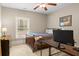 Comfortable bedroom with desk, closet, and window allowing natural light, ideal for work or relaxation at 208 Greenhill Dr, Dallas, GA 30157