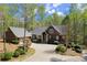 Beautiful single Gathering home with lush trees, stone facade, and a winding driveway at 208 Greenhill Dr, Dallas, GA 30157