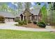 Charming two-story home with a well-manicured front yard and a spacious driveway leading to a two-car garage at 208 Greenhill Dr, Dallas, GA 30157