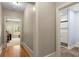 Hallway leading to the bedroom and bathroom with stylish floors and walls at 208 Greenhill Dr, Dallas, GA 30157