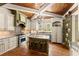 Bright and spacious kitchen with an island, granite countertops, and stainless steel appliances at 208 Greenhill Dr, Dallas, GA 30157