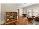 Cozy living room features hardwood floors, wicker furniture and bookshelf at 208 Greenhill Dr, Dallas, GA 30157