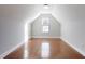 Finished attic space with window, hardwood flooring, and white trim at 277 Edison Dr, Stockbridge, GA 30281