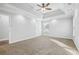 Bright bedroom with tray ceiling, carpet flooring, and natural light at 277 Edison Dr, Stockbridge, GA 30281