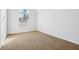 Bedroom featuring a bright window and neutral carpeting at 277 Edison Dr, Stockbridge, GA 30281