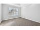 Bedroom featuring a bright window and neutral carpeting at 277 Edison Dr, Stockbridge, GA 30281