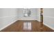 Dining room features hardwood floors, neutral tones, a chandelier, and windows for ample natural light at 277 Edison Dr, Stockbridge, GA 30281
