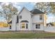Back of house showing the chimney, fence, and bay window area at 277 Edison Dr, Stockbridge, GA 30281