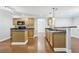 Bright kitchen with wood cabinets, stainless steel appliances, and a center island at 277 Edison Dr, Stockbridge, GA 30281