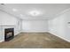 Spacious living room with a fireplace and neutral carpet at 277 Edison Dr, Stockbridge, GA 30281